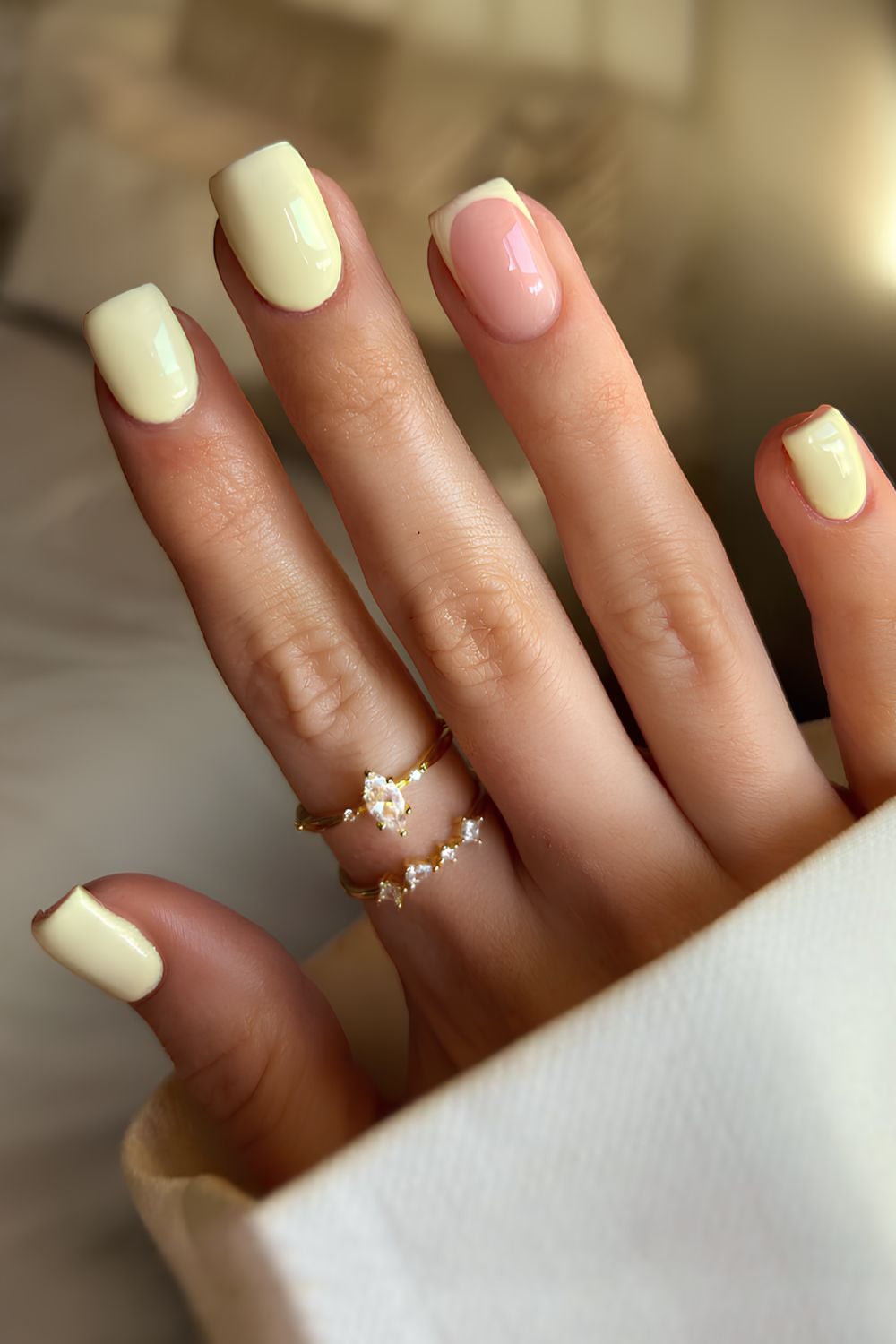 Butter yellow manicure with accent french tip