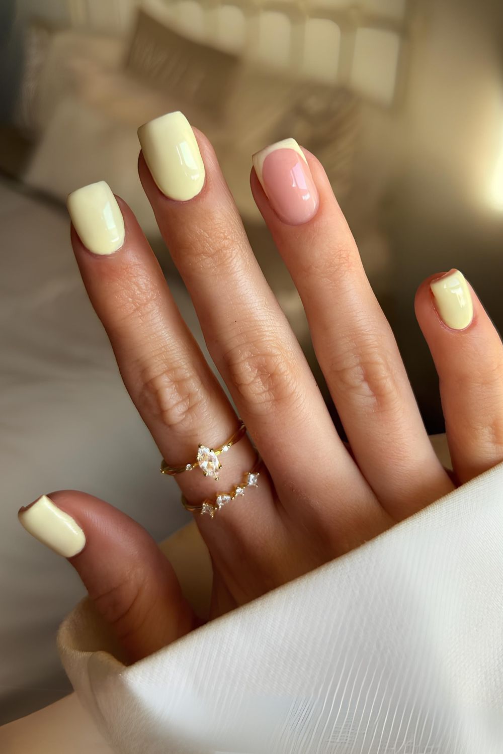 Butter yellow nails with accent french tip