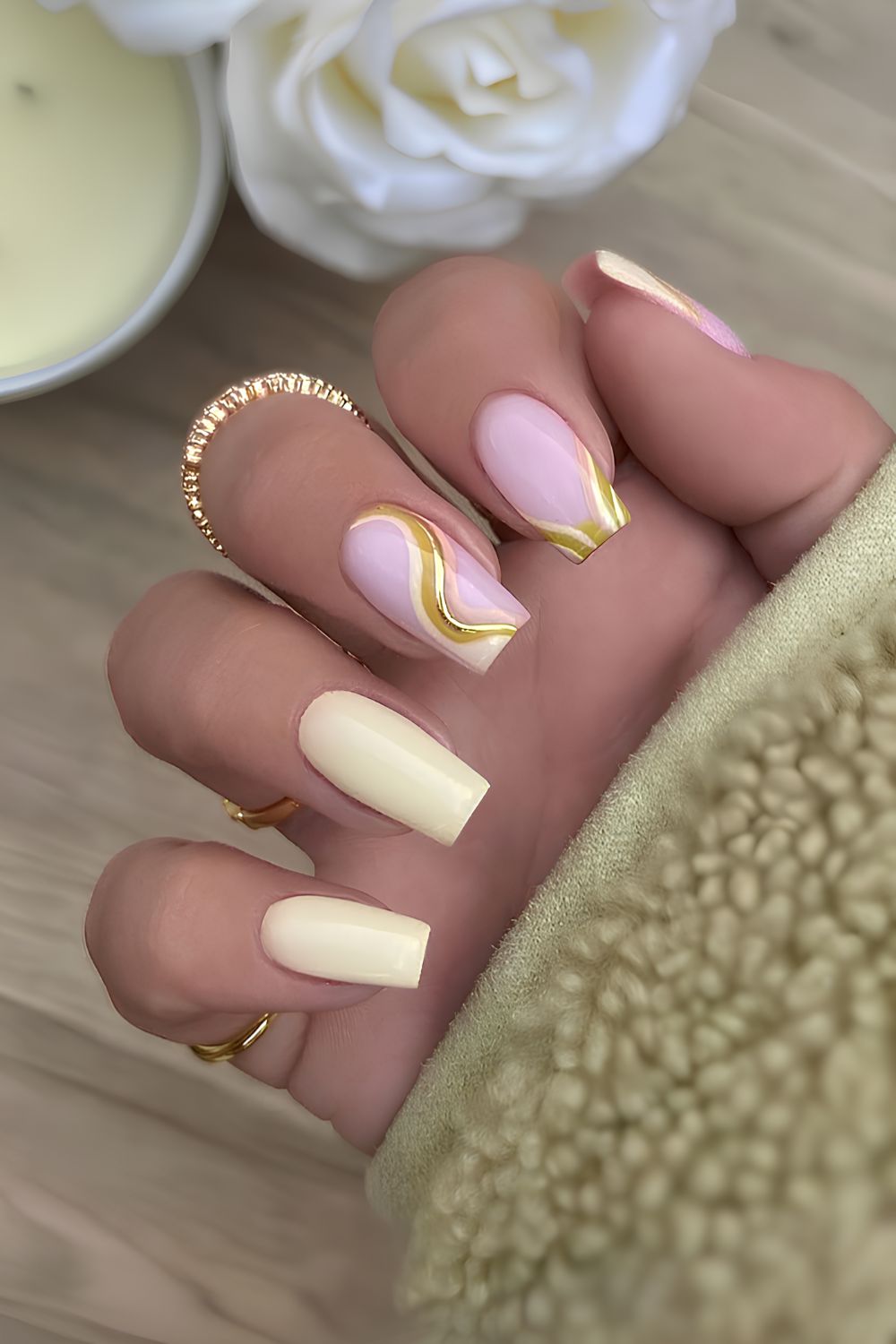 Butter yellow nails with gold swirl accent