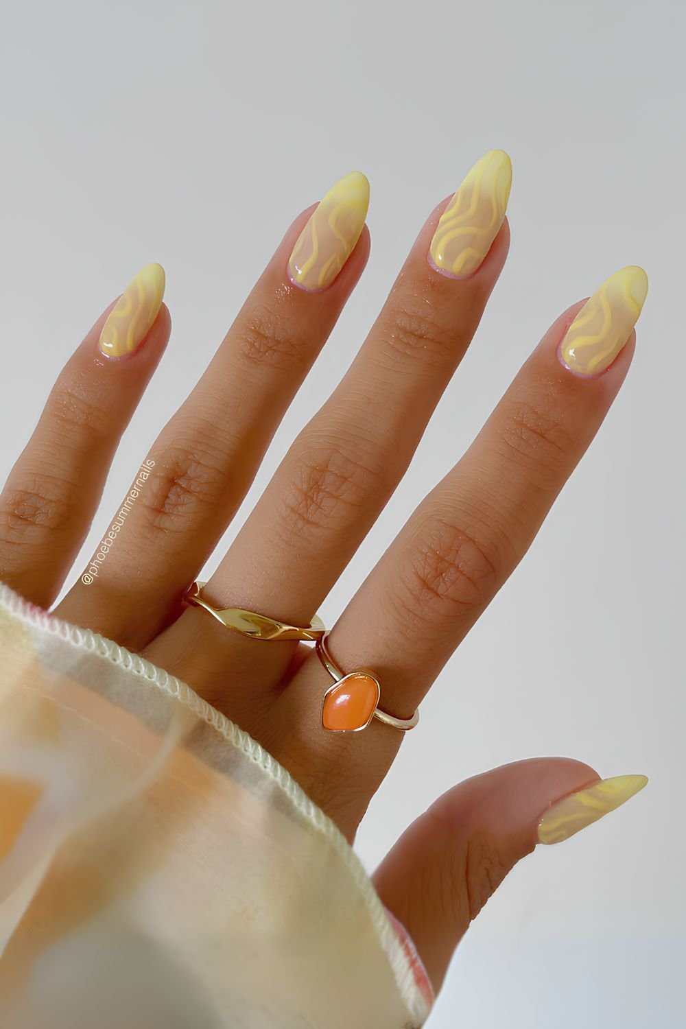 Butter yellow ombre nails with swirls