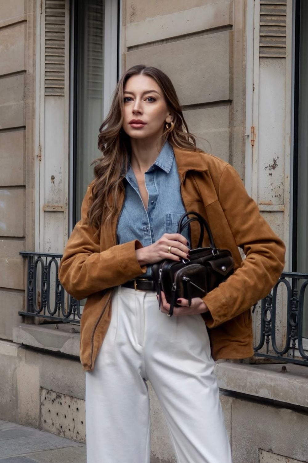 Camel suede jacket with denim shirt and white pants