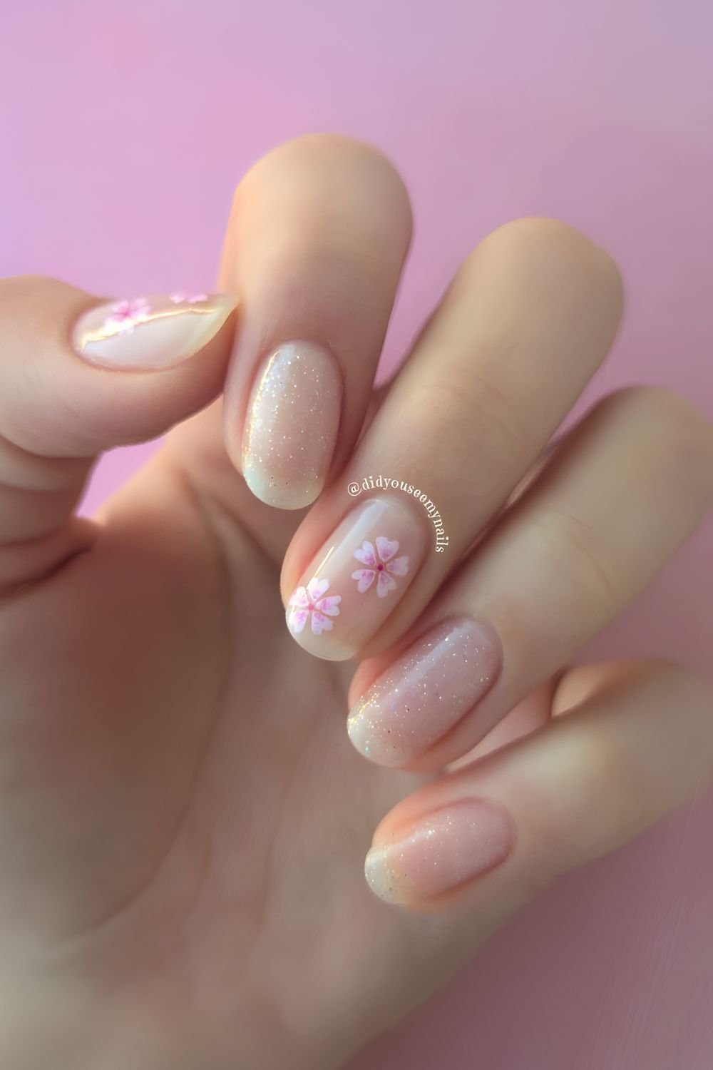 Cherry blossom nails with glitter accent