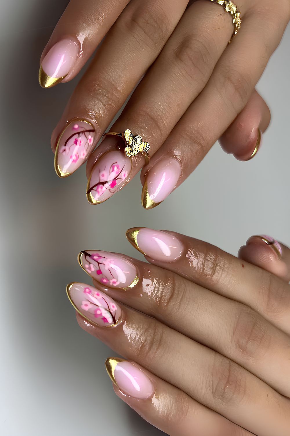 Cherry blossom nails with gold accents
