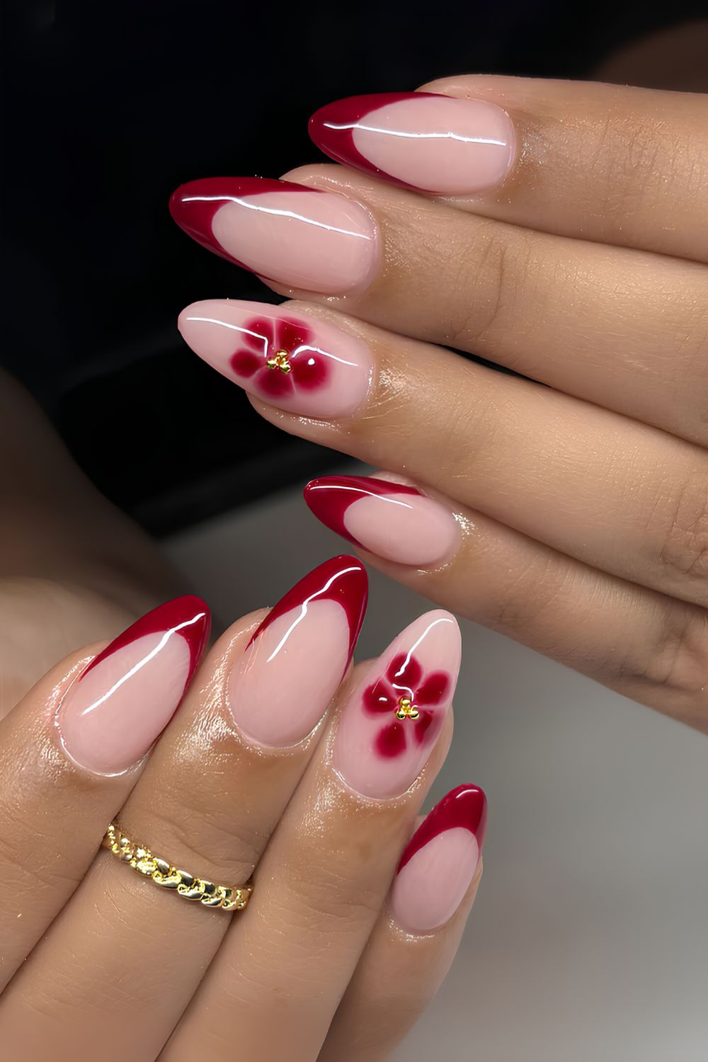 Cherry red French mani with blooming flowers