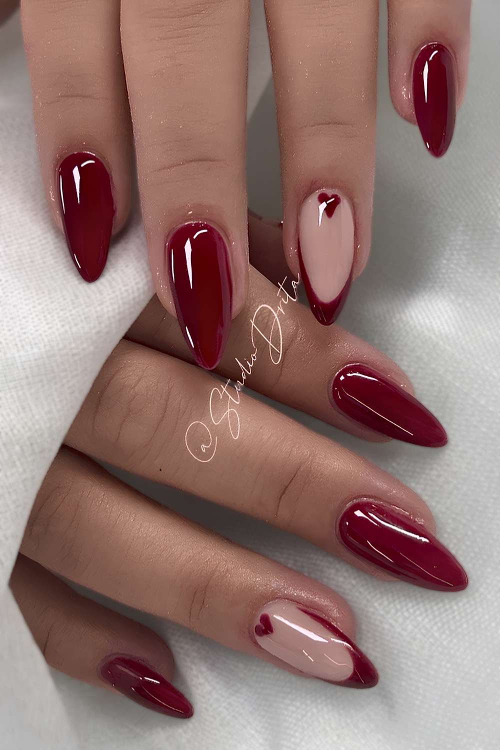 Cherry red mani with accent heart art