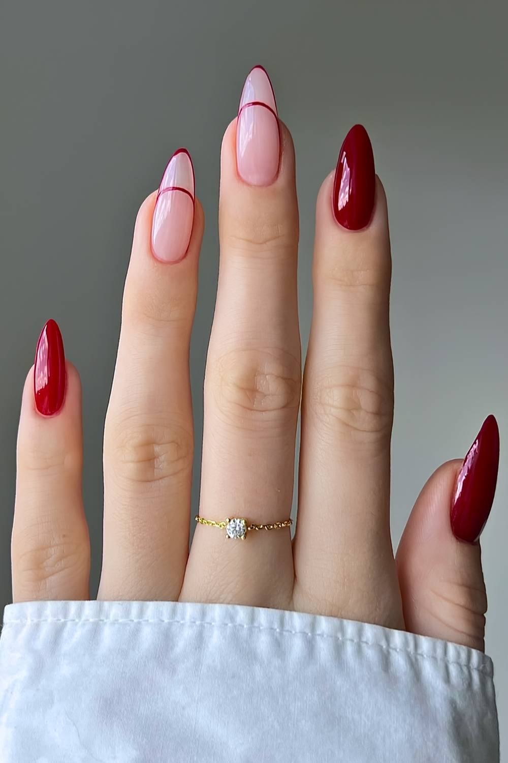 Cherry red nails with accent French tip outlines