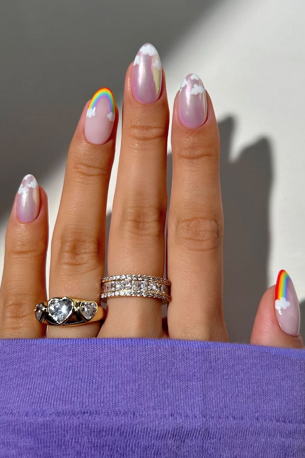 Chrome nails wit clouds and rainbow french tip accent