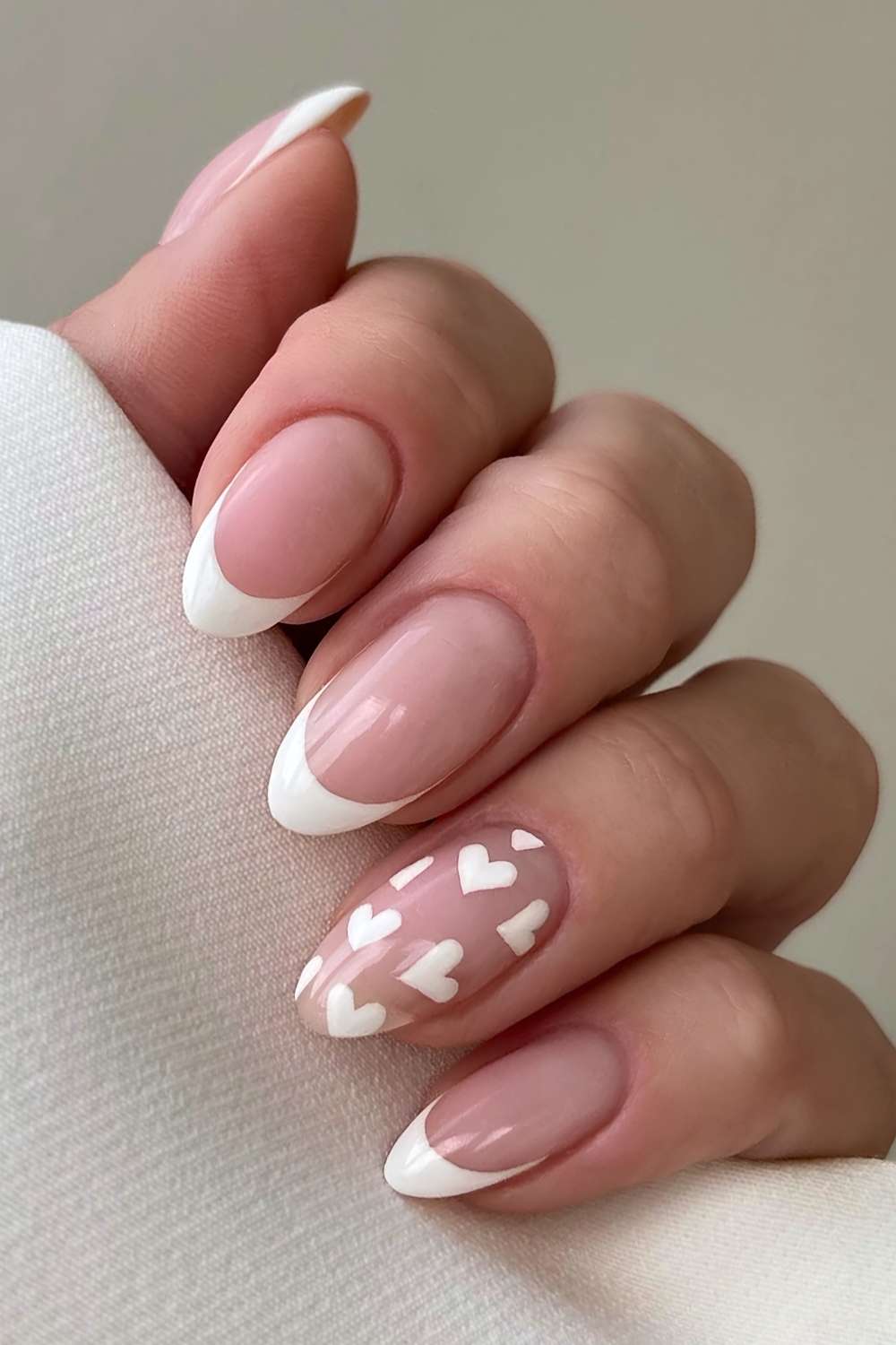 Classic white French nails with heart art