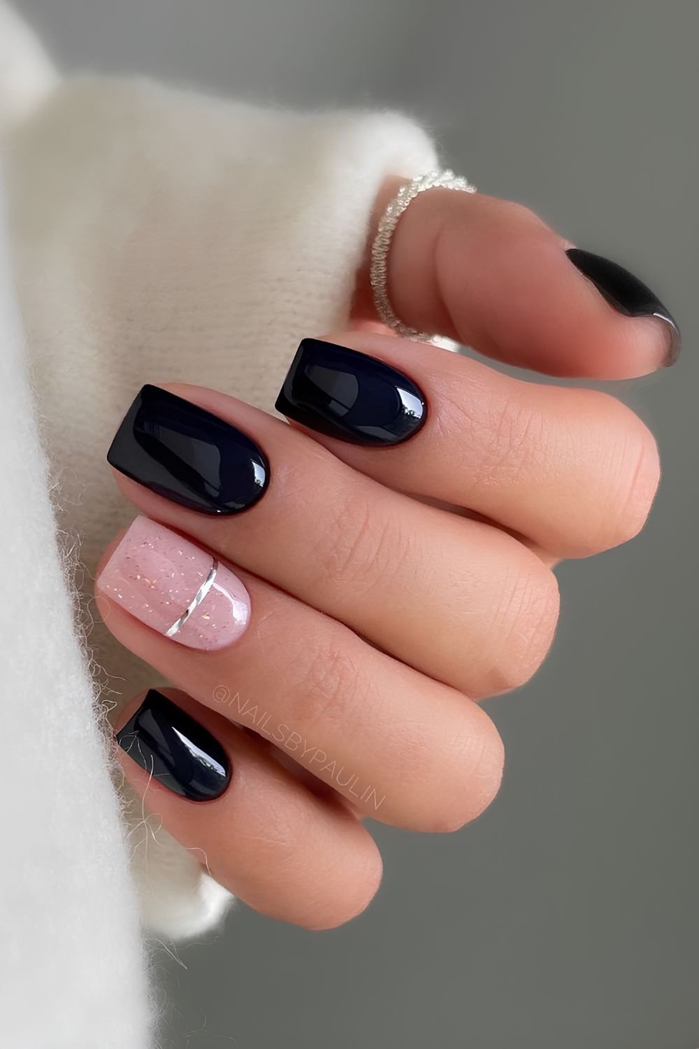 Classy black nails with accent chrome line