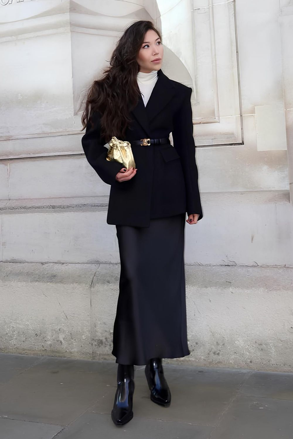 Classy black silk skirt paired with black blazer and white turtleneck
