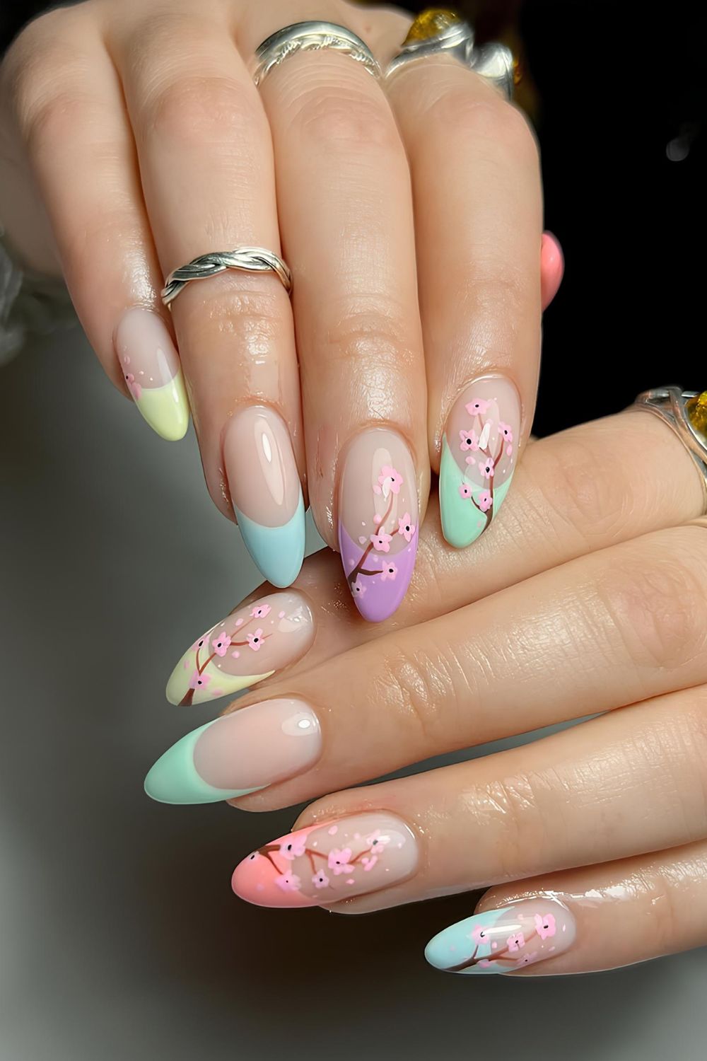 Colorful French nails with cherry blossoms