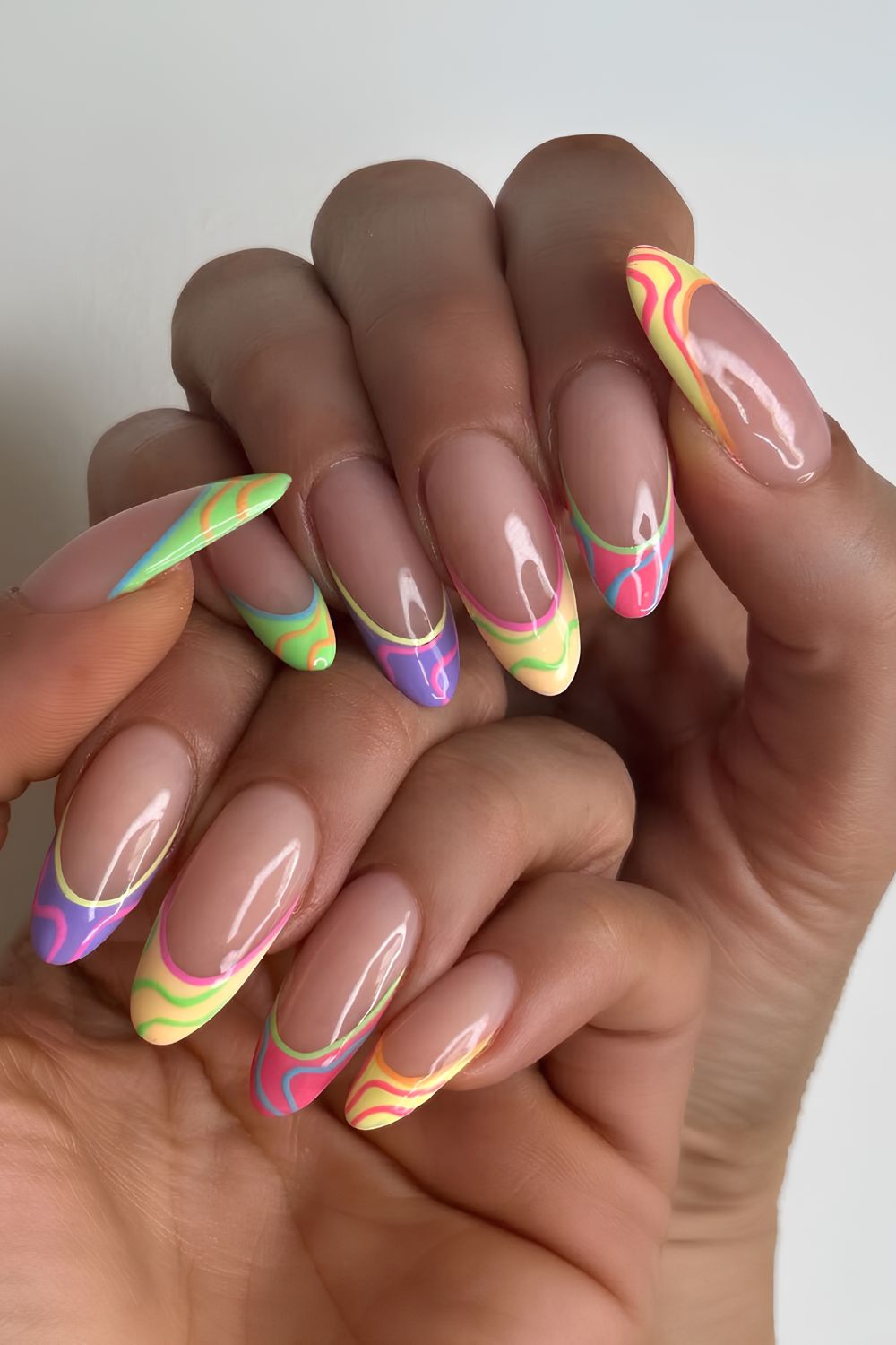 Colorful French nails with swirls