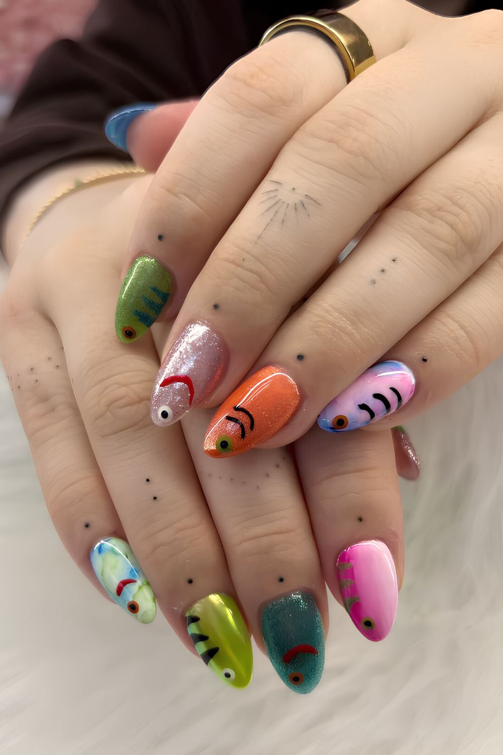 Colorful fish nails with glitter and chrome accents