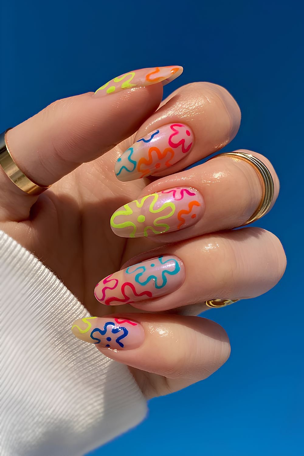 Colorful floral nails on neutral base
