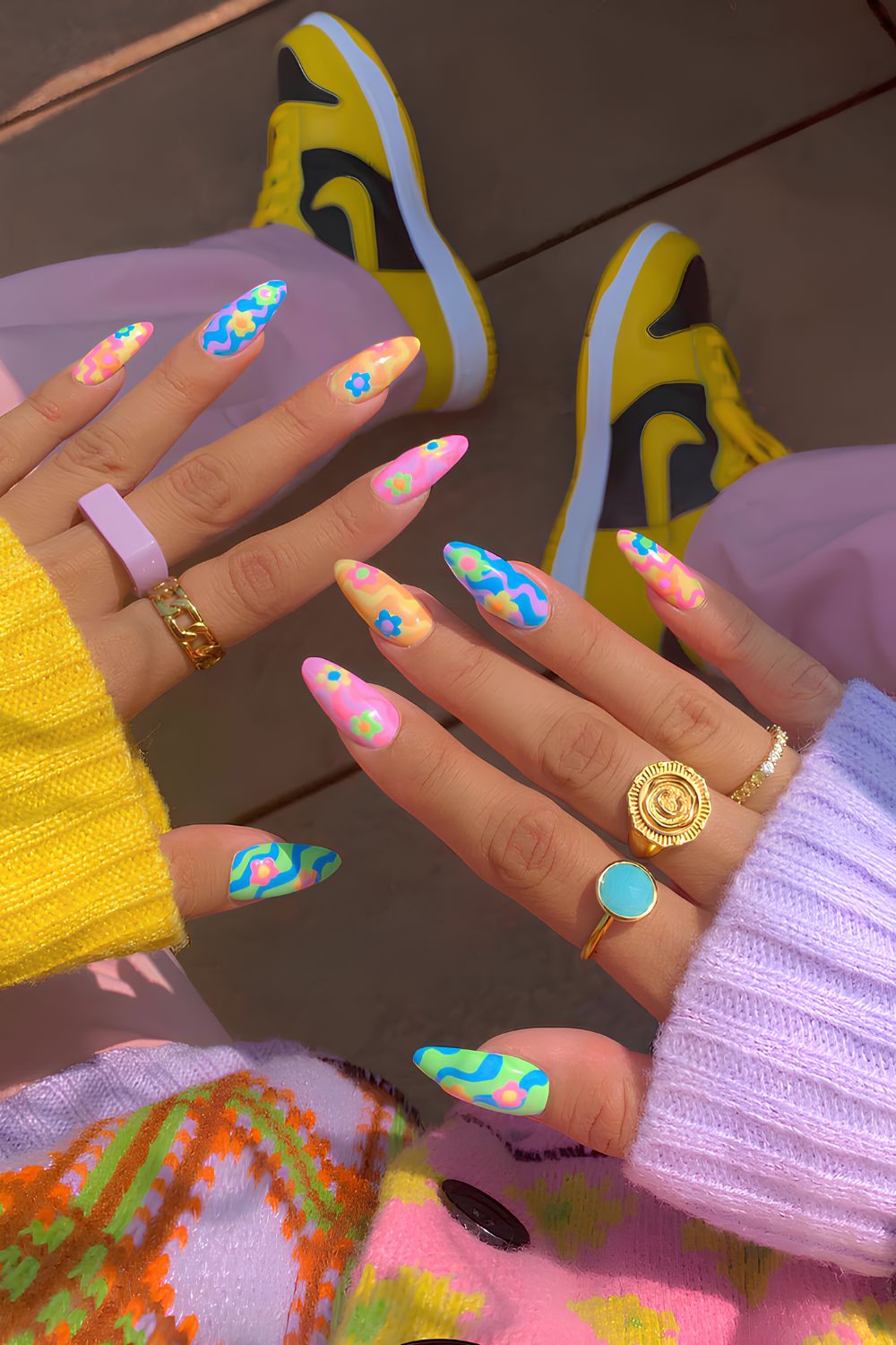 Colorful floral nails with swirl accents