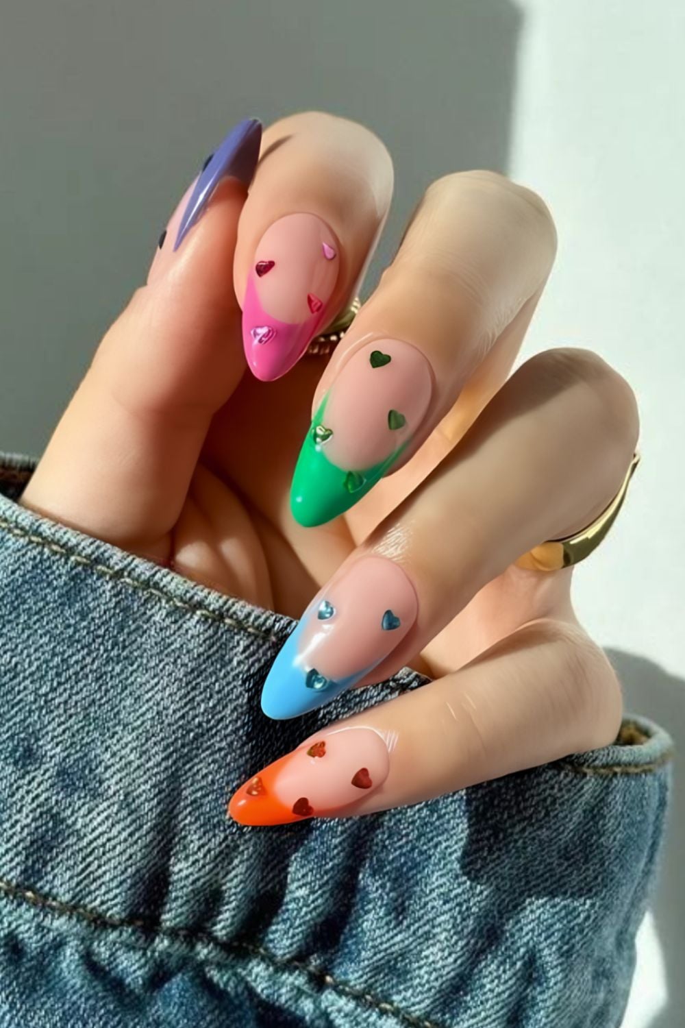Colorful french tips with matching heart gems