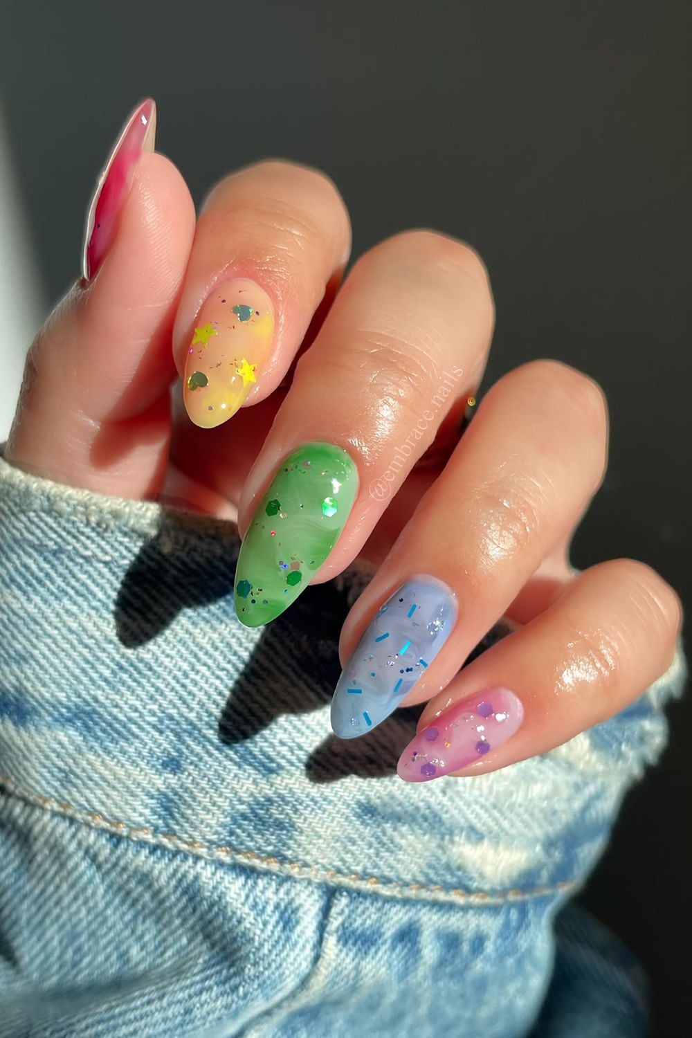 Colorful marble nails with stars and heart glitter