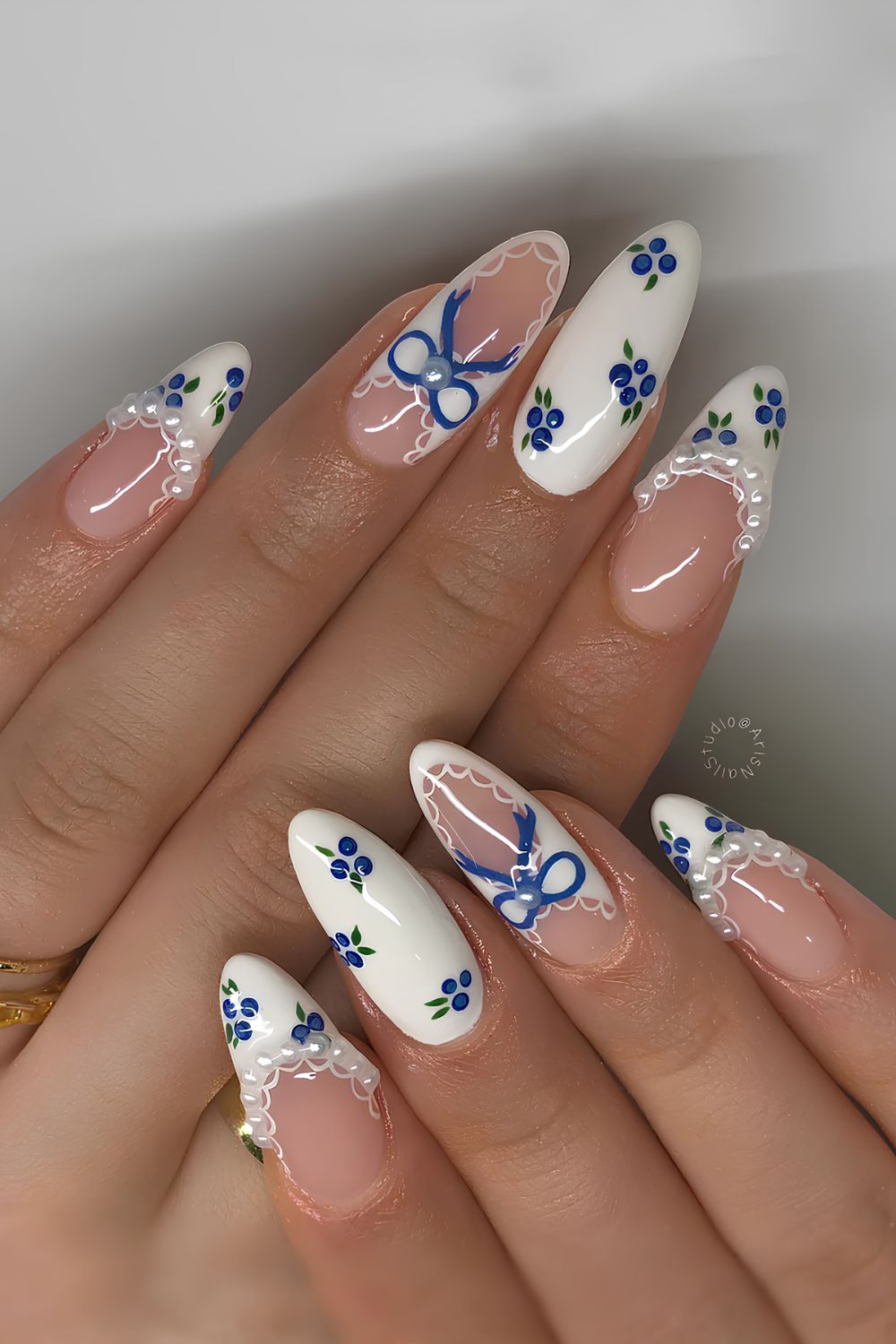 Coquette nails with blueberries, bows and pearls