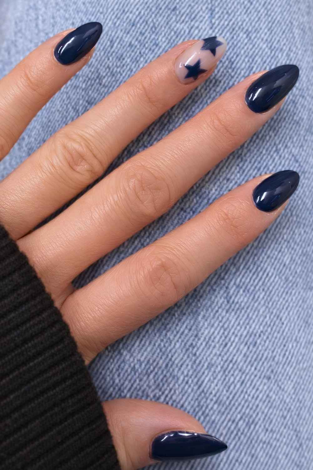 Dark blue mani with accent star art