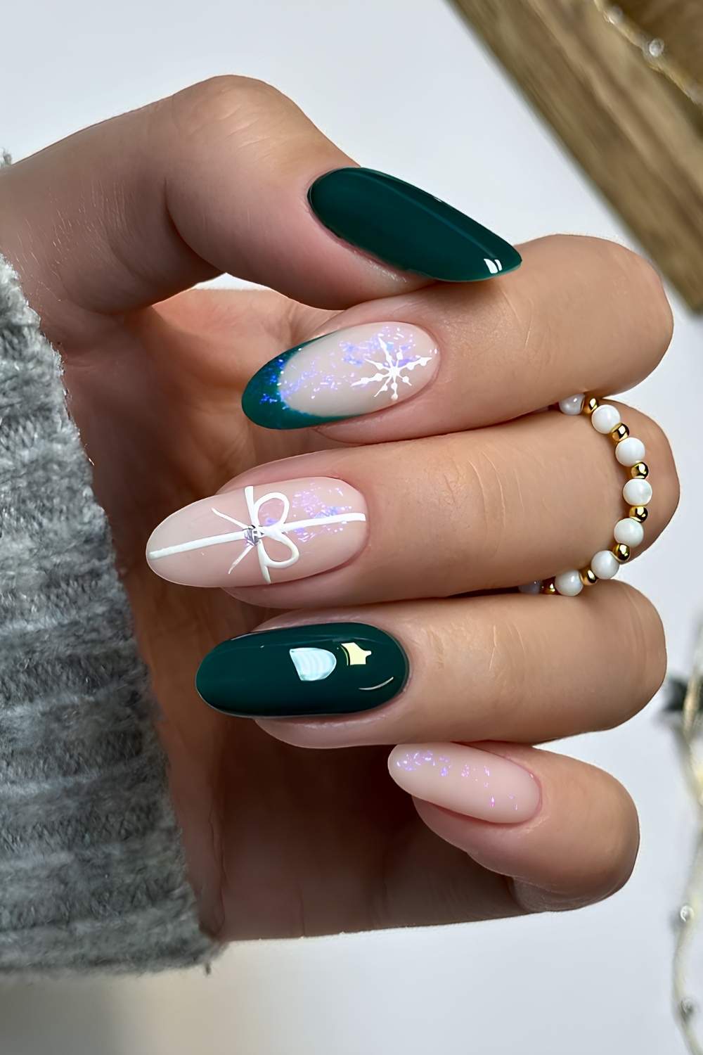Dark green and white nails with Christmas motifs