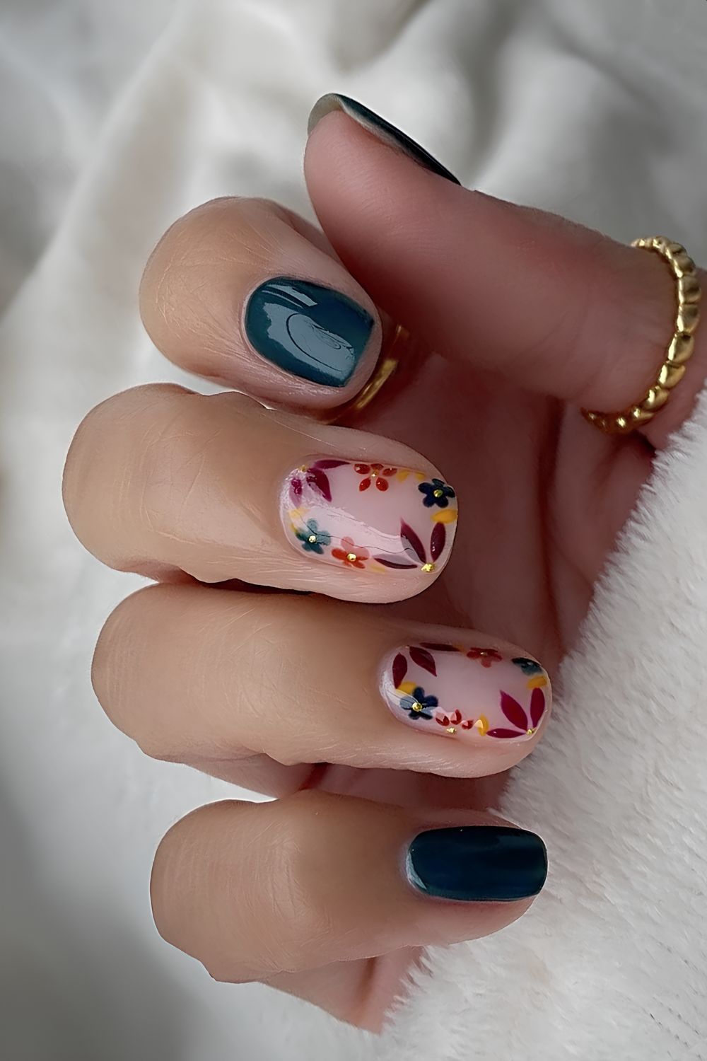 Dark green nails with earthy flower art