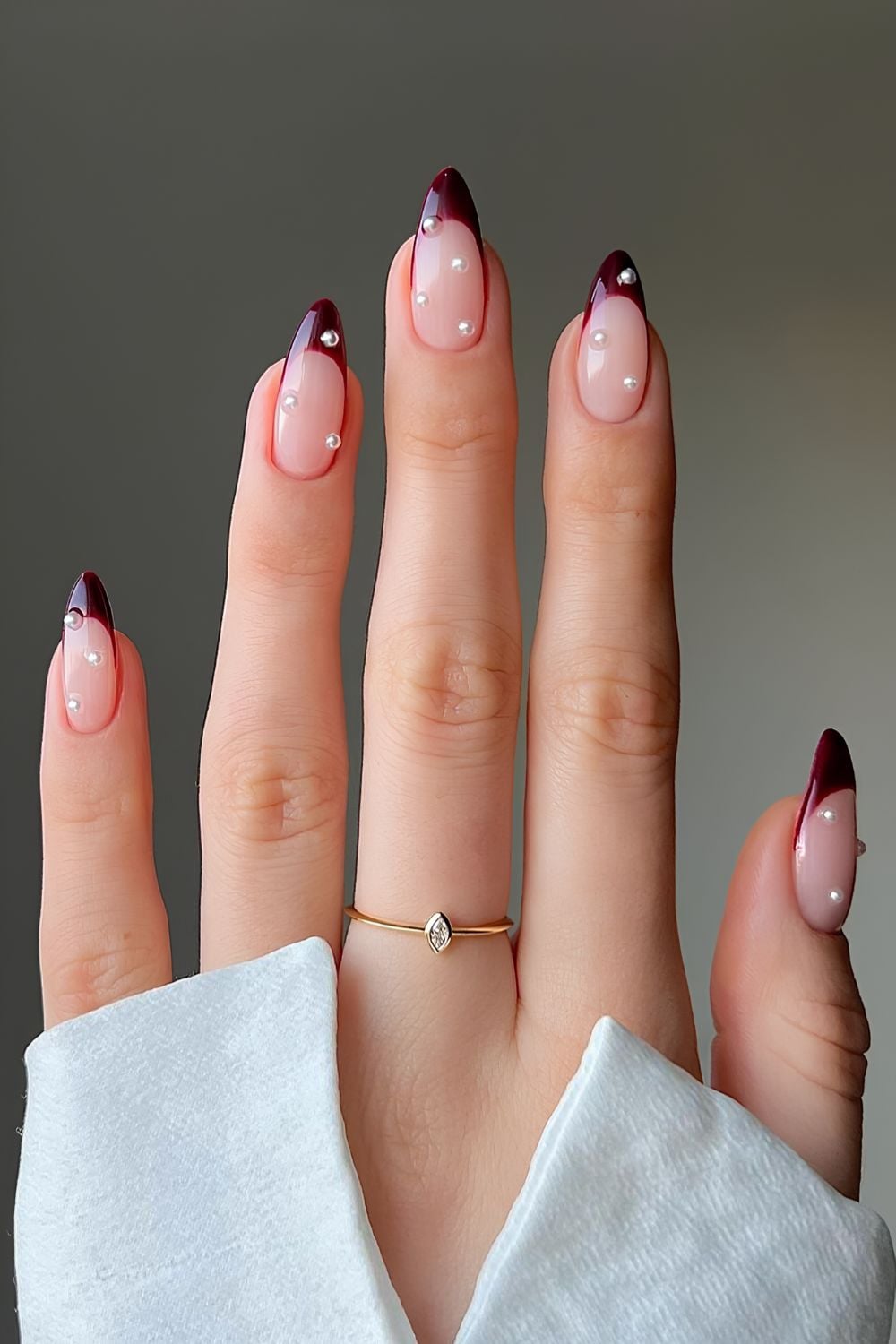 Dark red French manicure with pearls