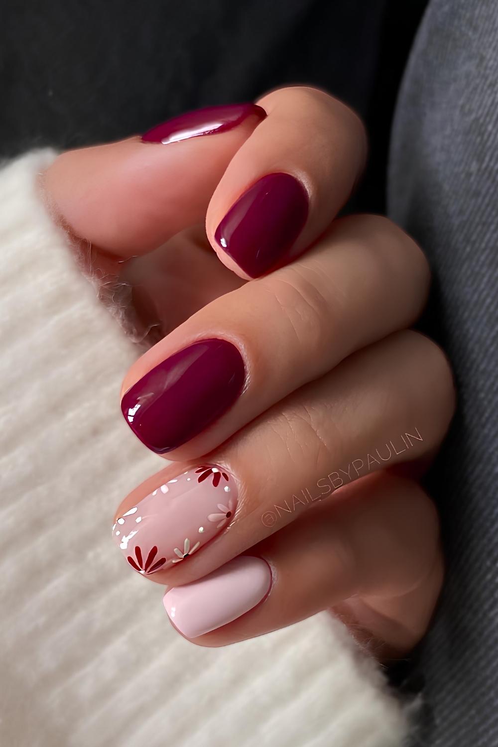Dark red and pink nails with floral art