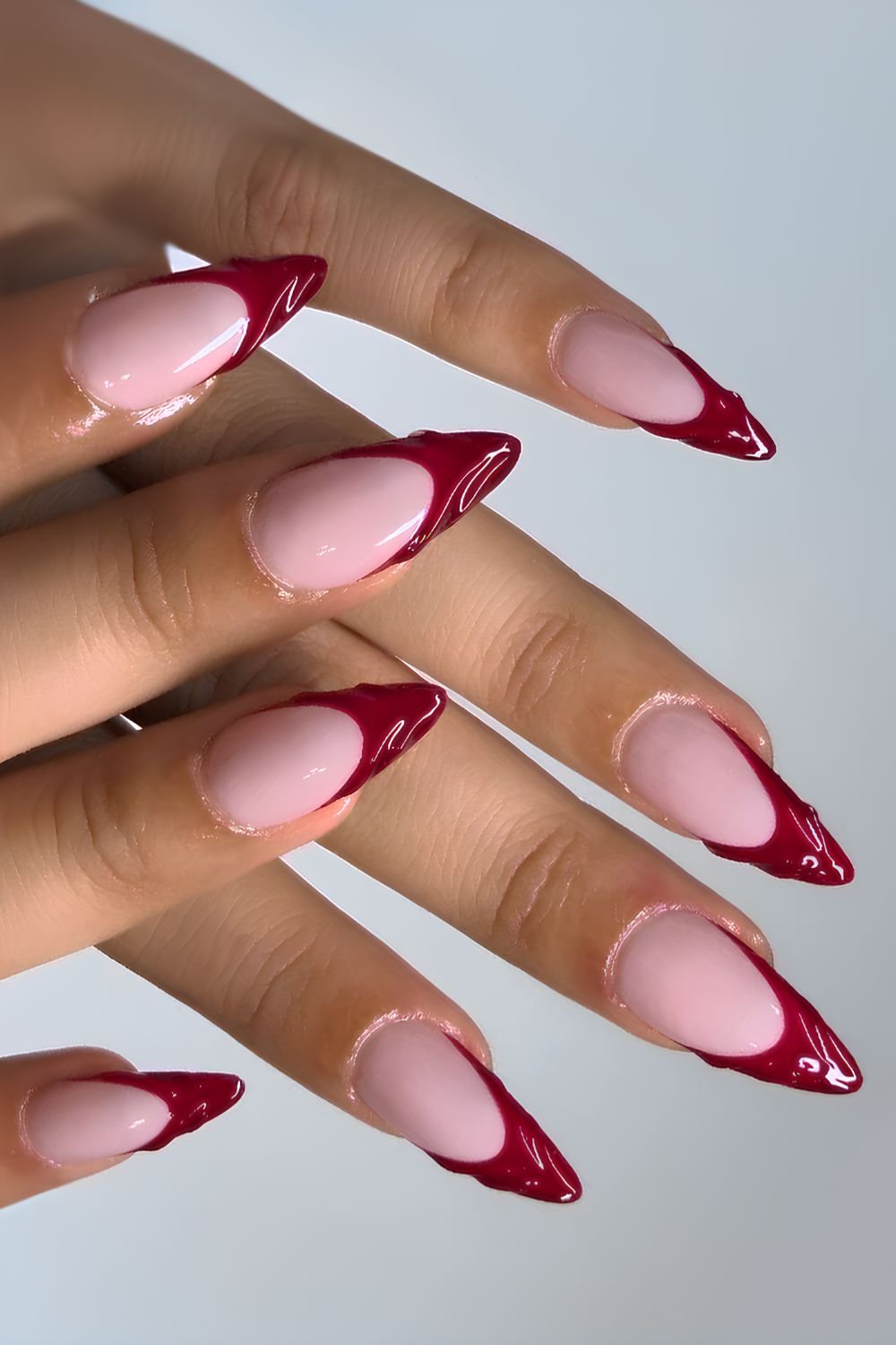 Dark red textured French nails