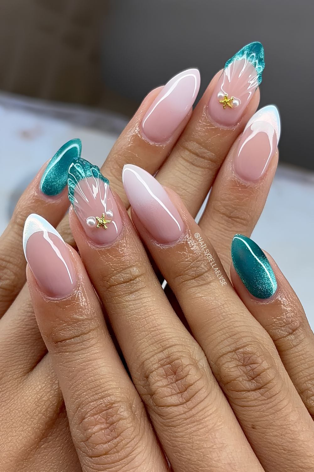 Dark teel cat eye and white ombre mermaid nails