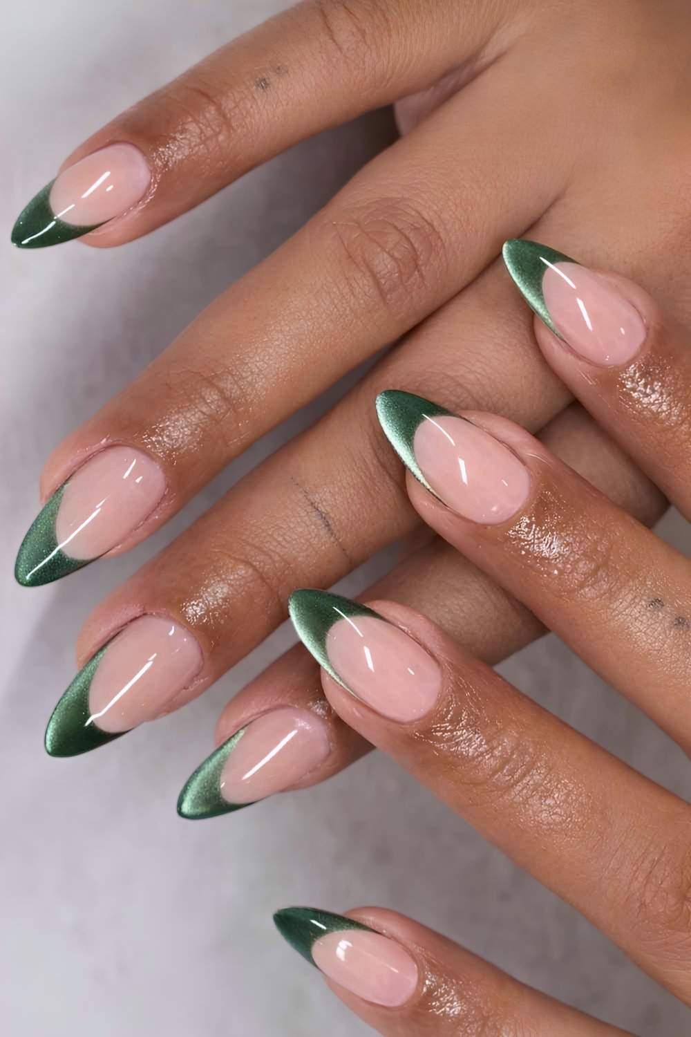 Deep green cat eye French manicure