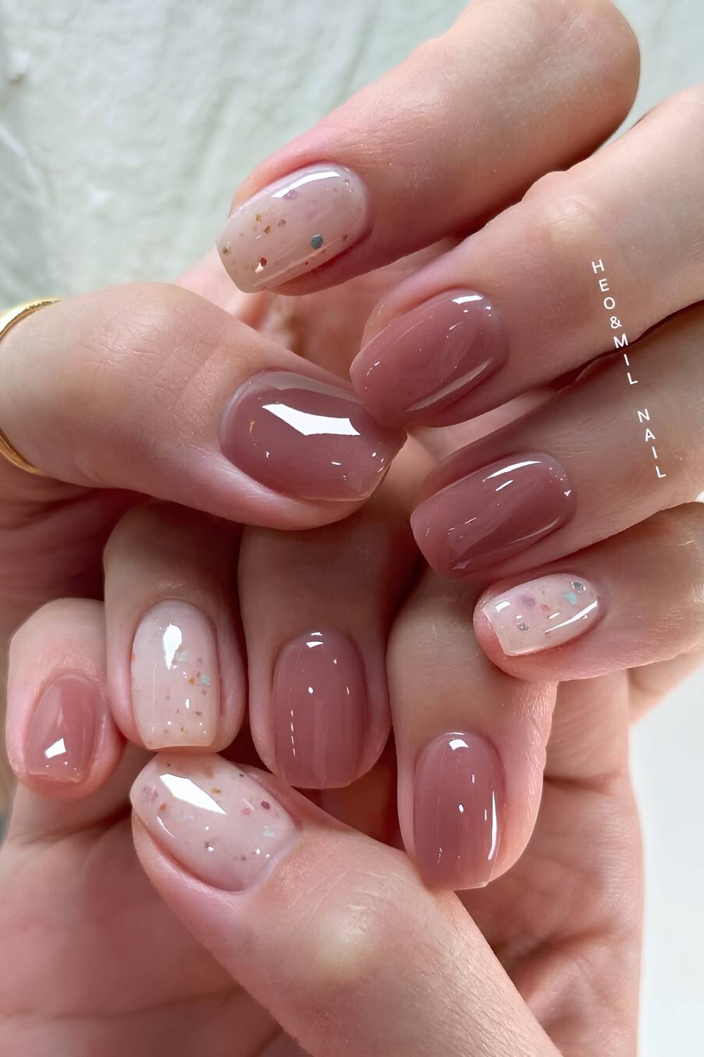 Deep mauve nails with holo glitter flakes