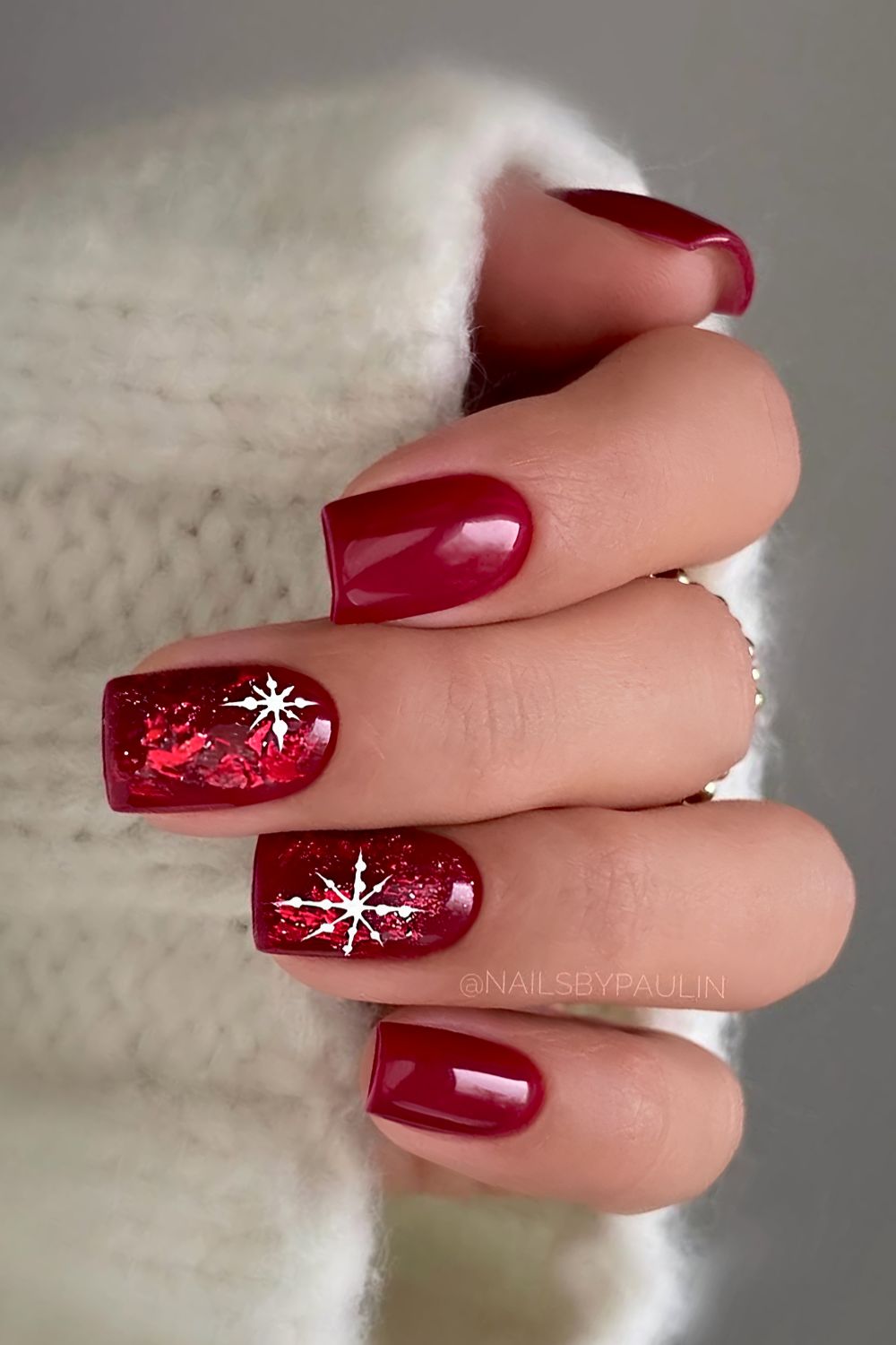 Deep red Christmas nails with snowflakes