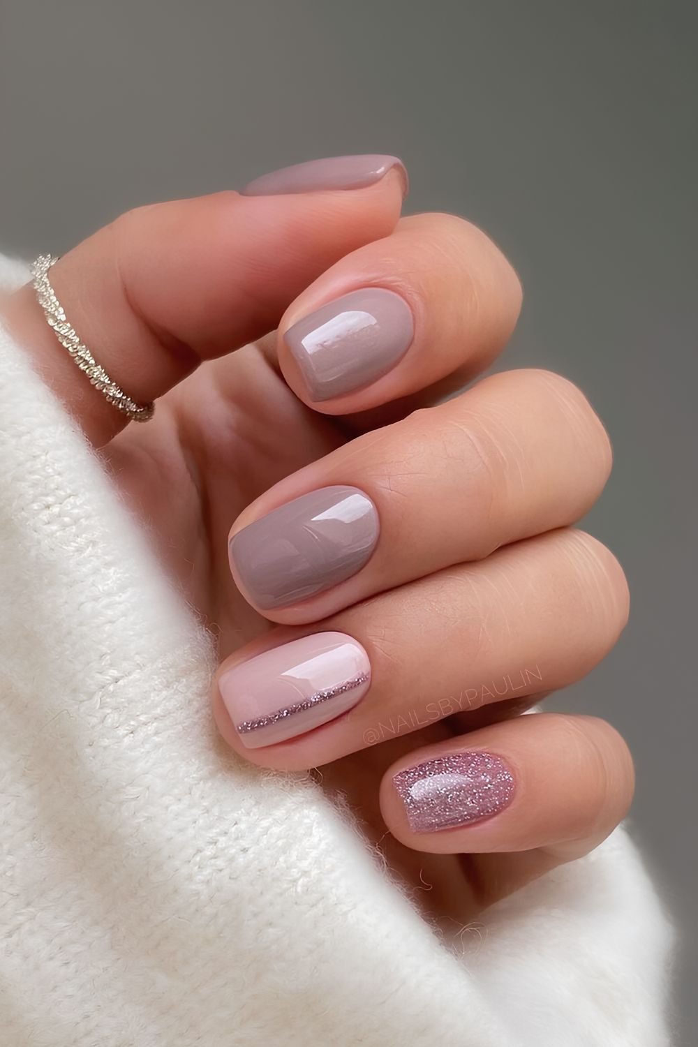 Dusty mauve nails with glitter accent