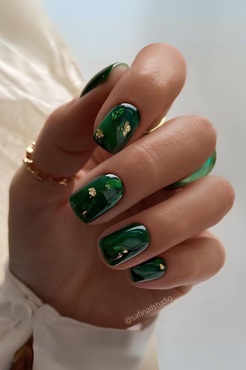 Emerald green marble mani with gold accents