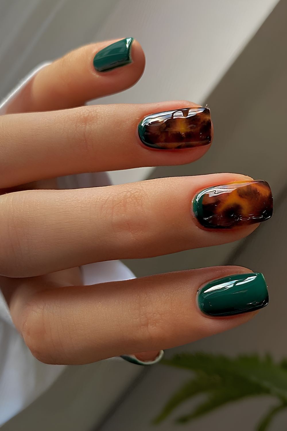 Emerald green nails with tortoise shell details