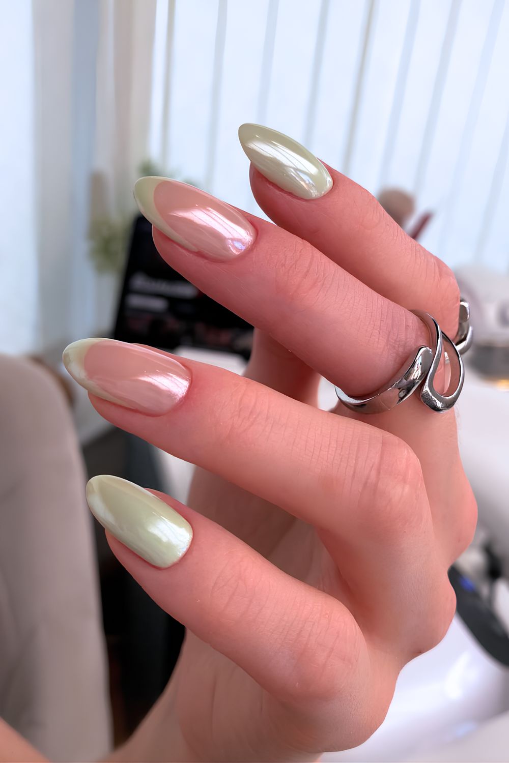 Glazed pistachio green nails with French tip accents