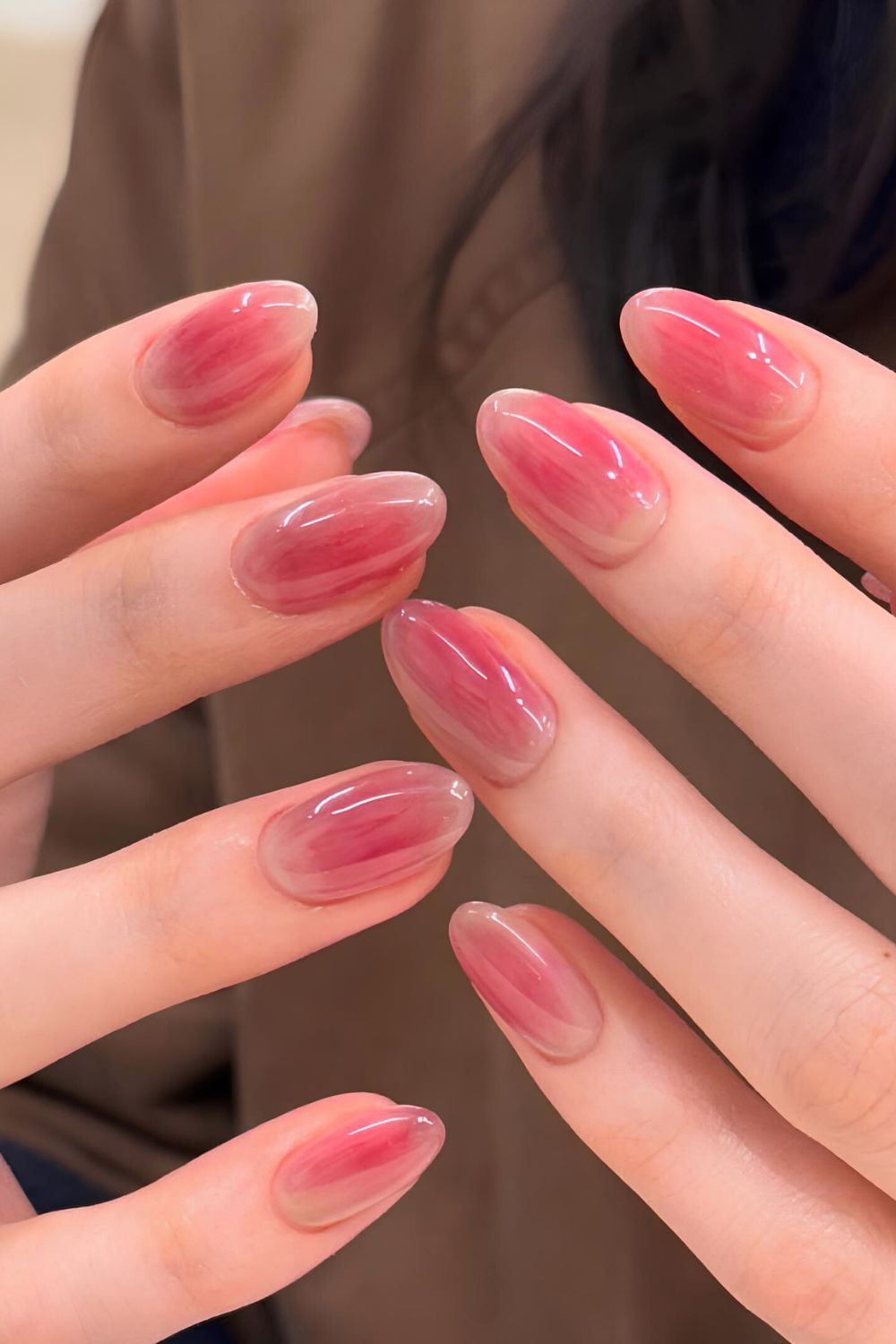 Glossy almond nails inspired by red grape skin