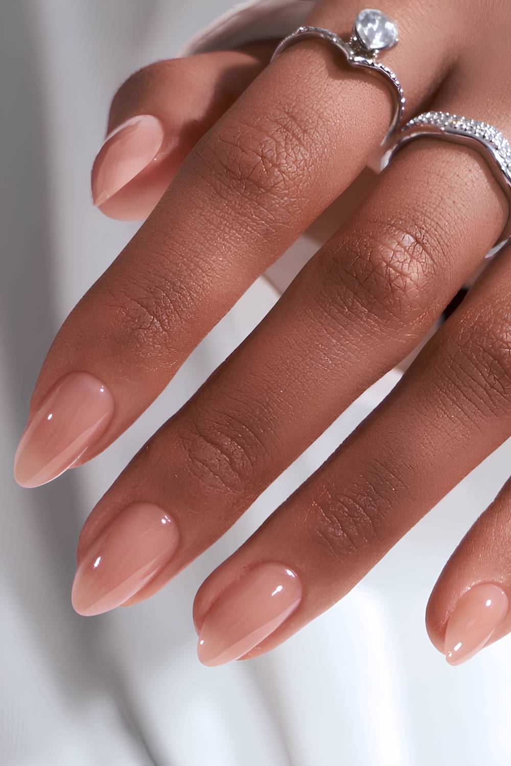 Glossy almond nude manicure