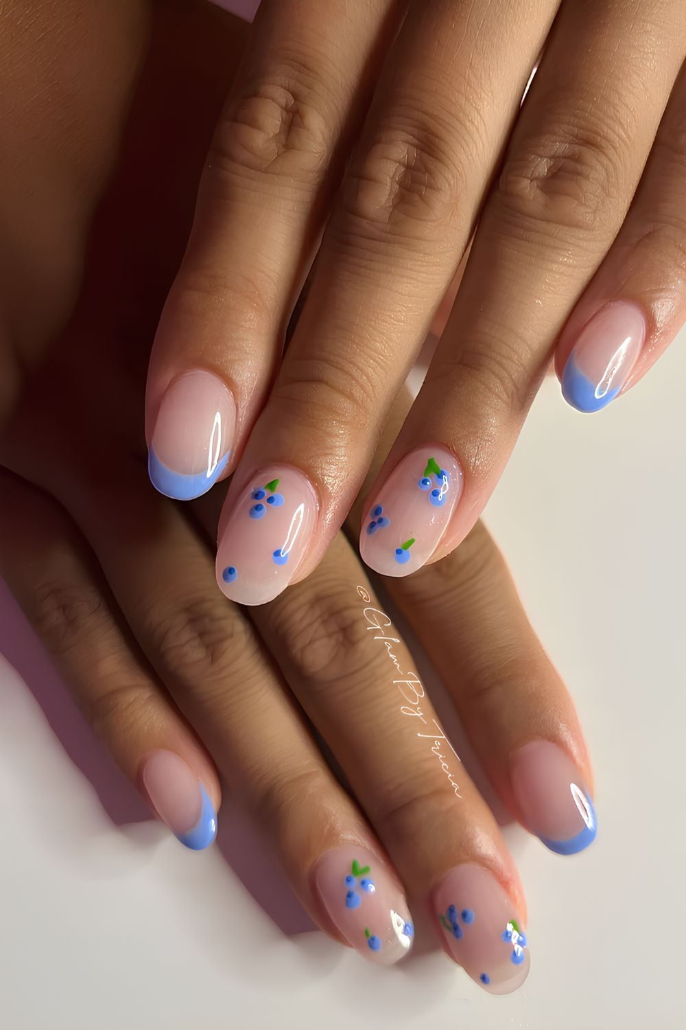 Glossy blue French mani with bluberries