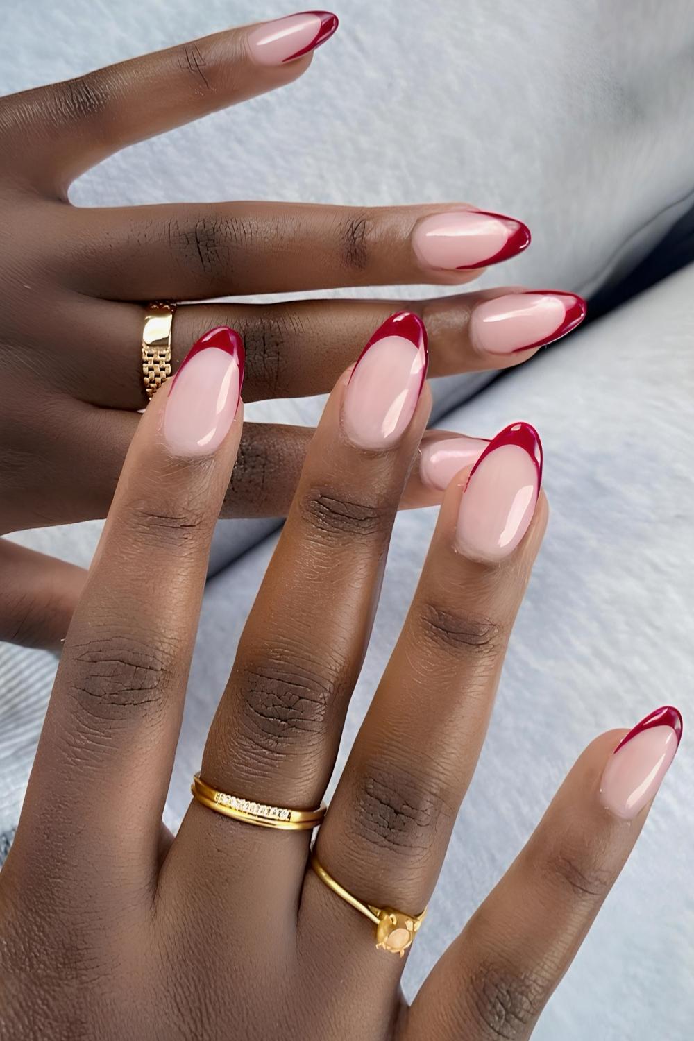 Glossy cherry red French mani on a milky base