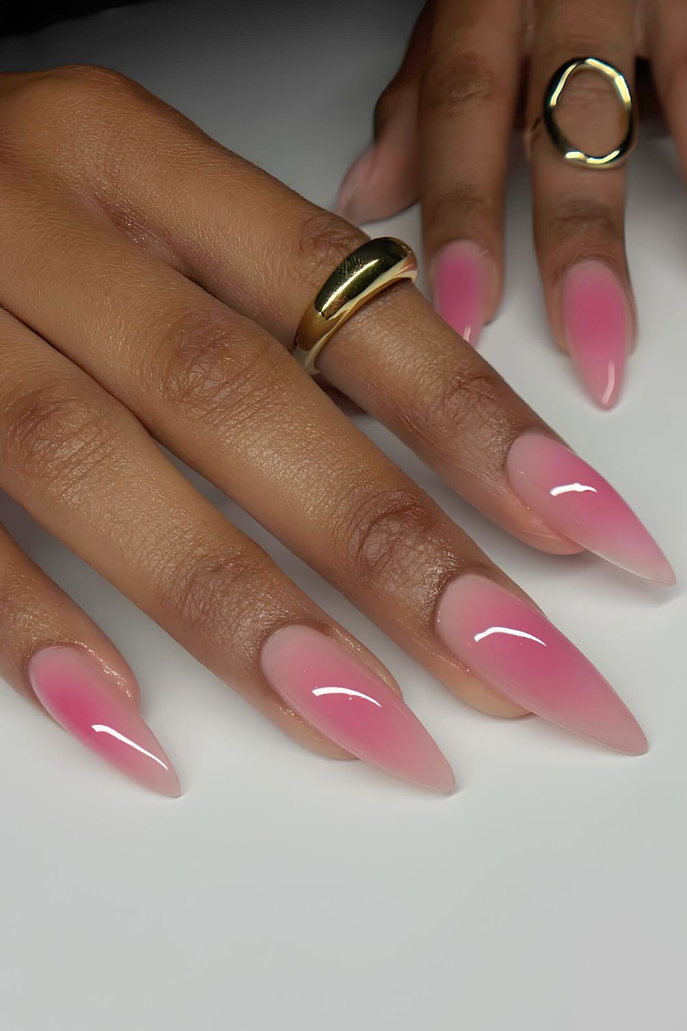 Glossy pink aura nails