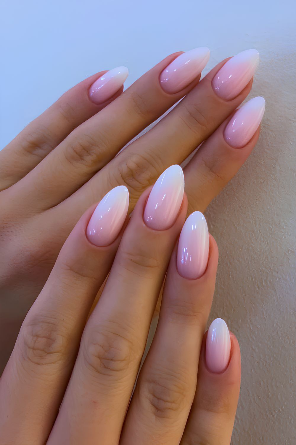 Glossy white to pink ombre manicure