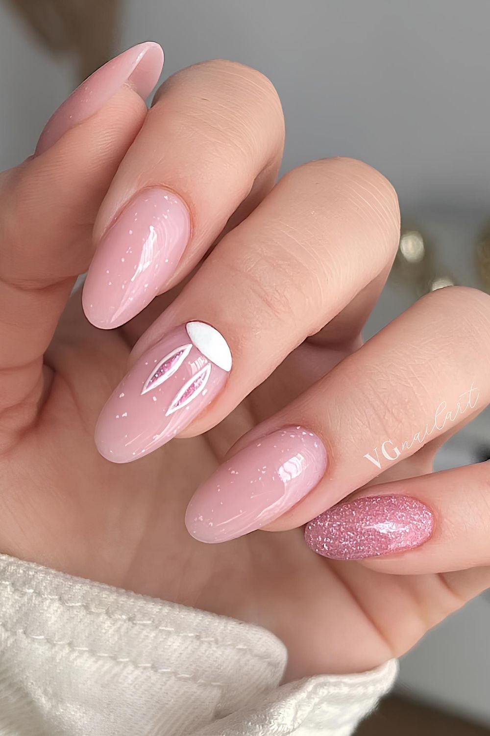 Glowy pink nails with glitter and fluffy bunny ears