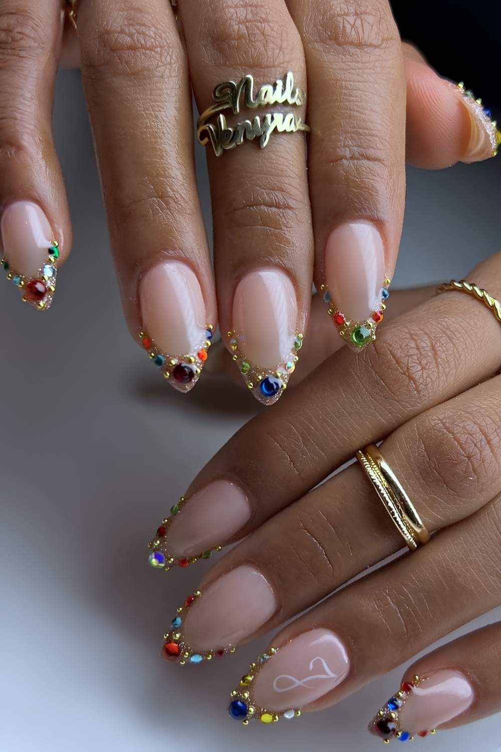 Gold French nails with colorful gems