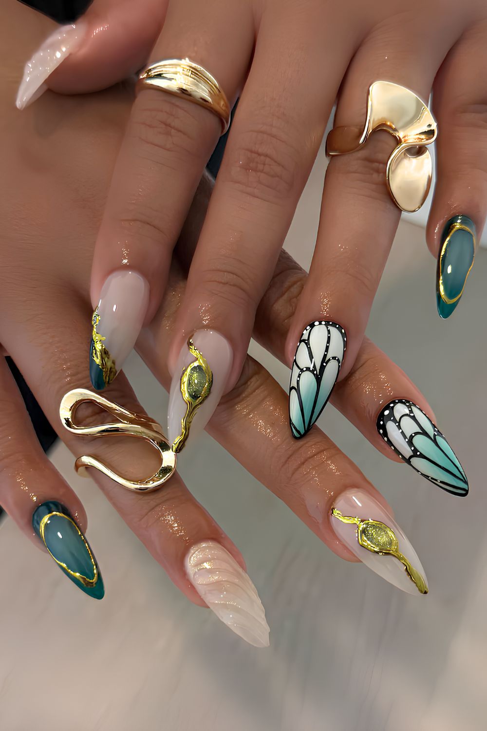 Gold and green nails with butterflies