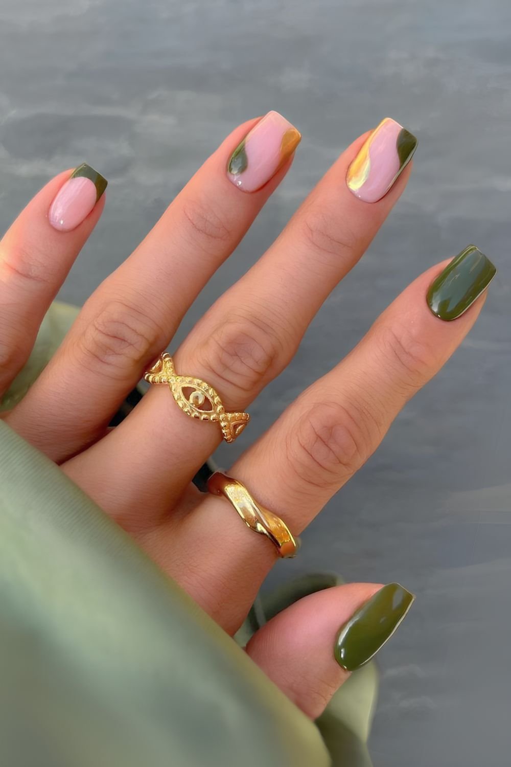 Gold and green nails with negative space design