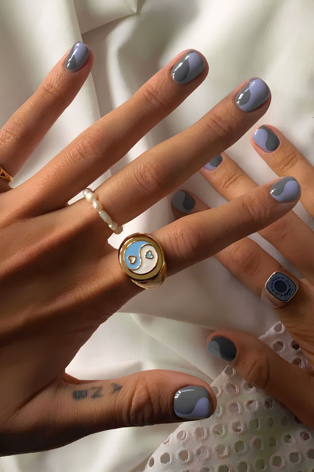 Gray and blue split swirl nails