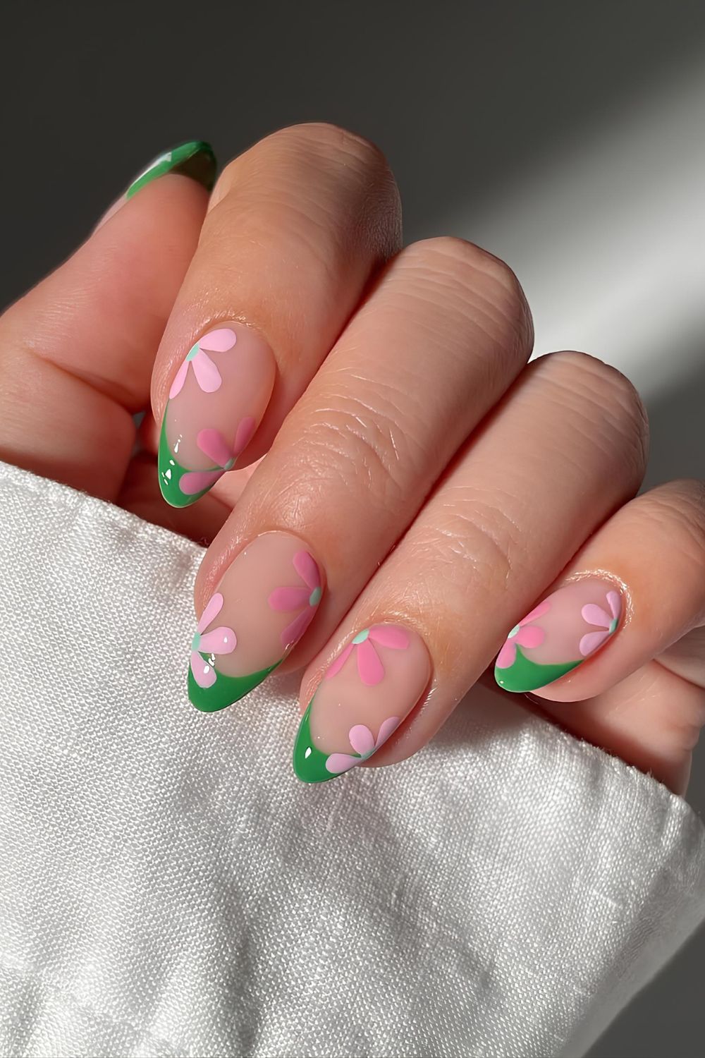 Green French nails with pink flowers