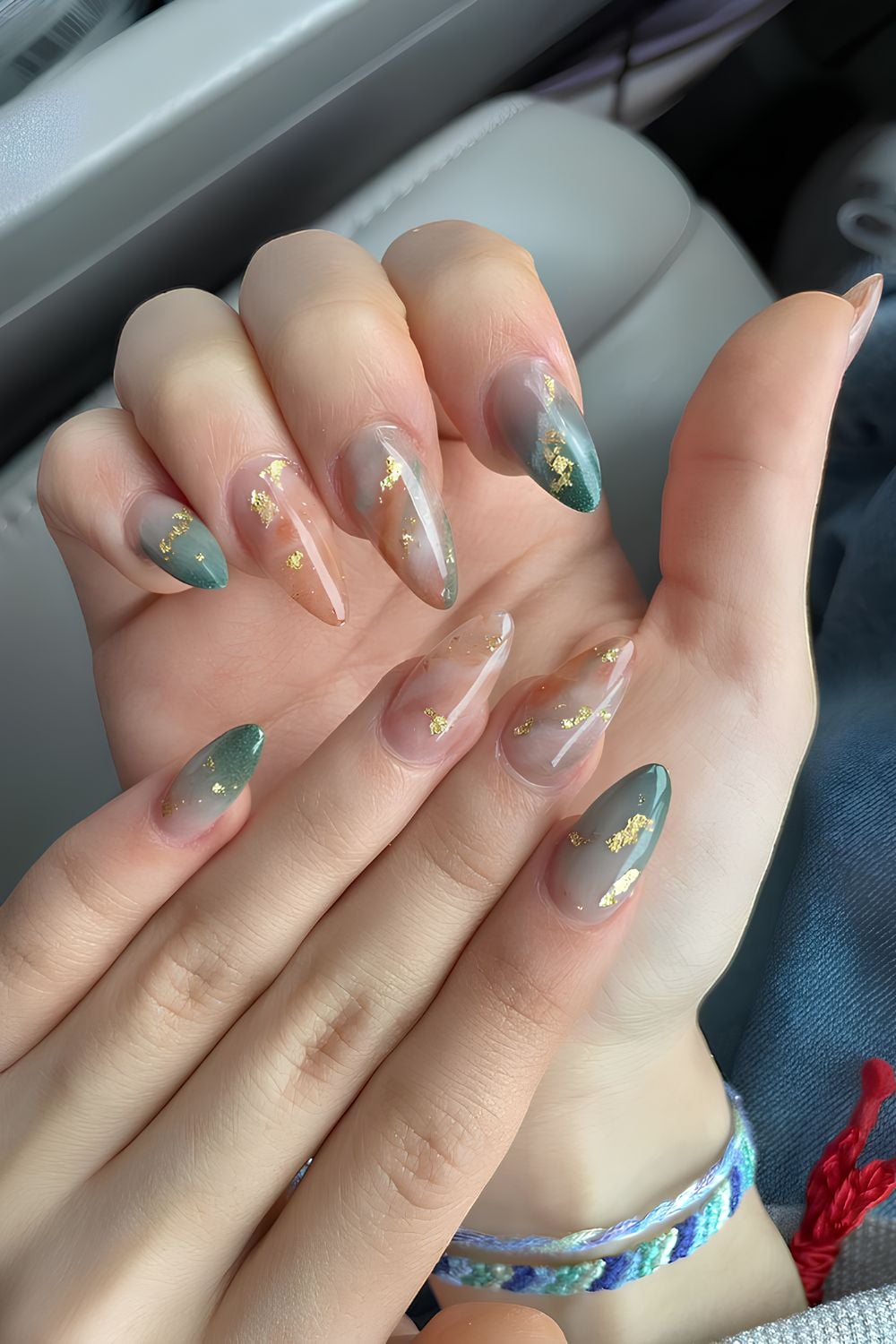 Green and brown marble nails with gold flecks