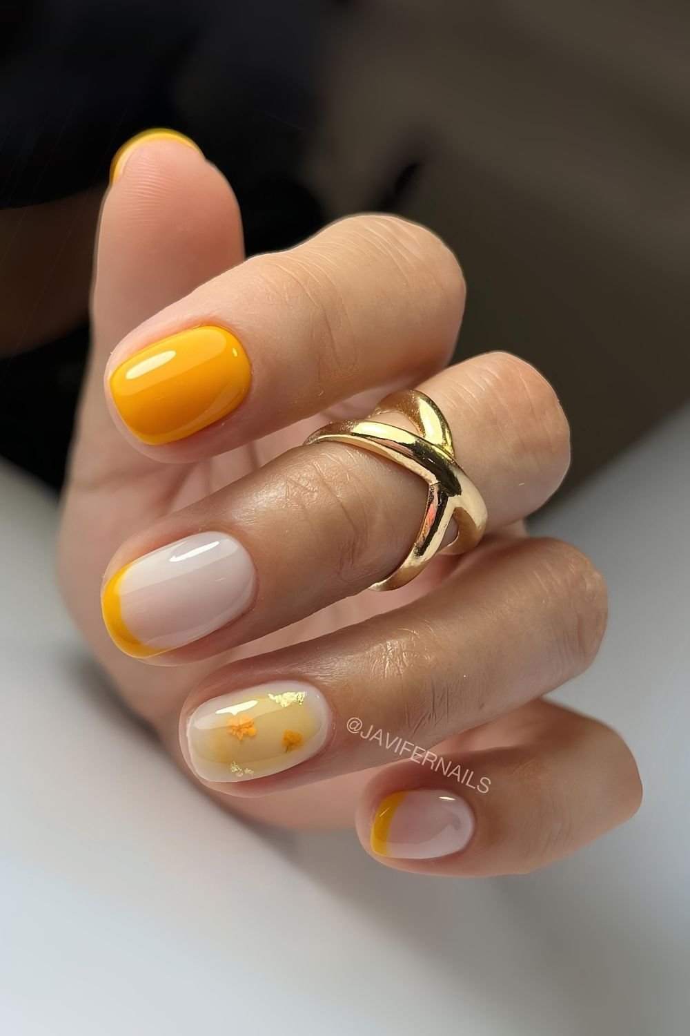 Honey yellow and milky white nails with floral aura accent
